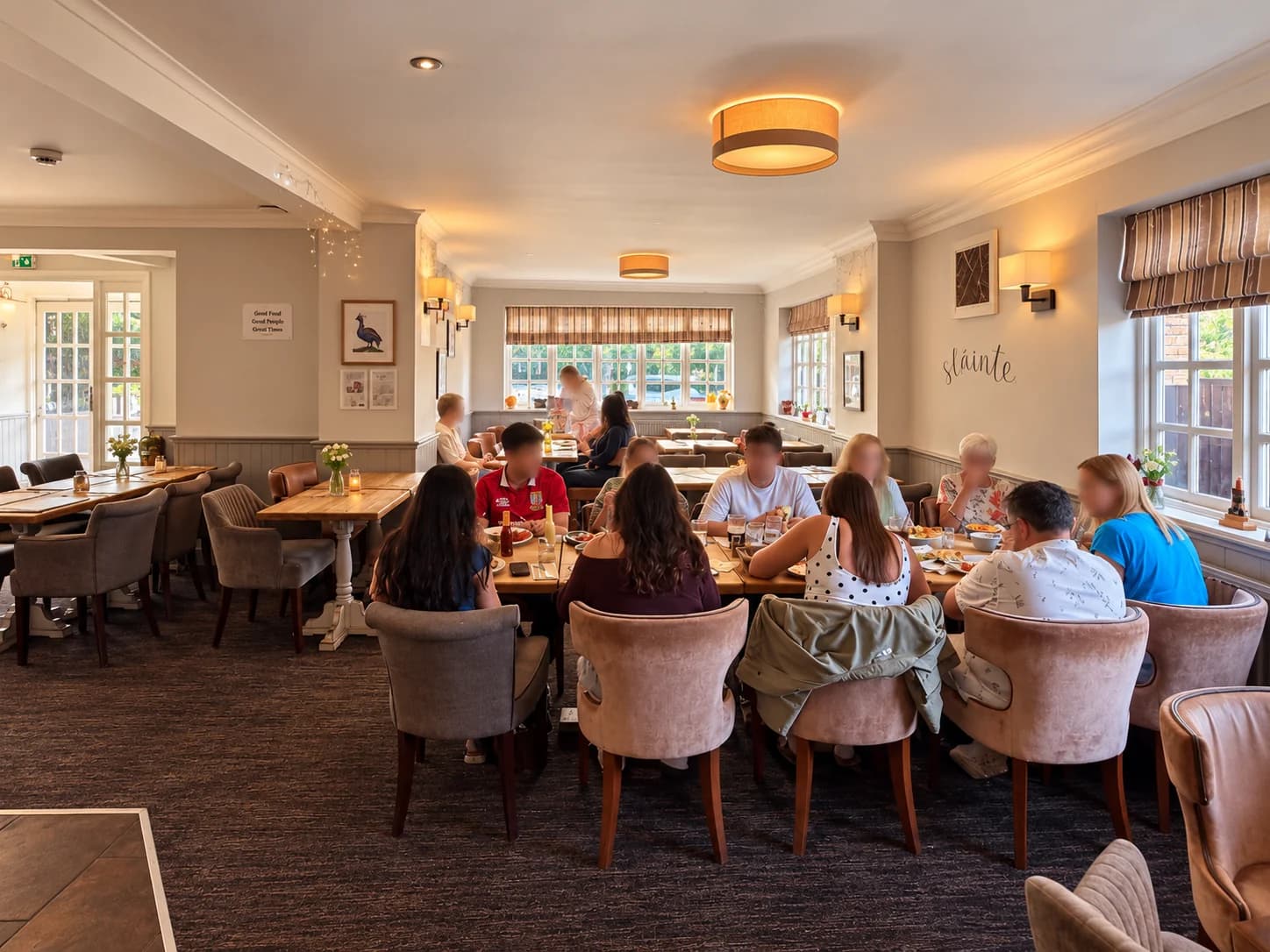 Guests sharing a meal in the dining room at The Prince of Wales