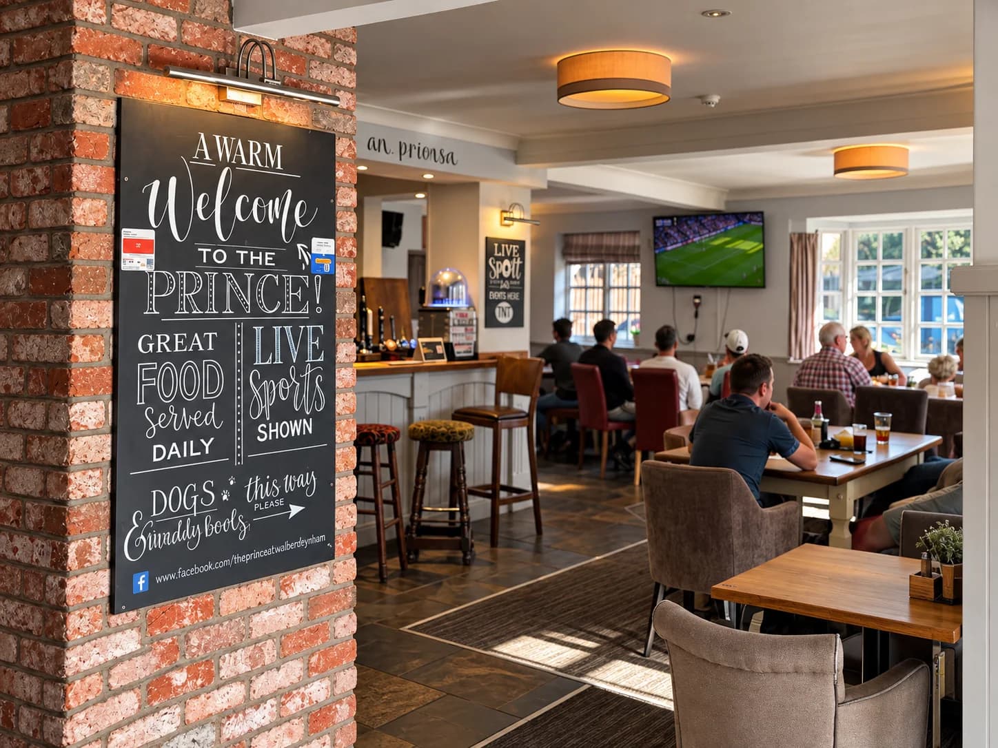 The welcome chalkboard beside the bar and sports lounge at The Prince of Wales